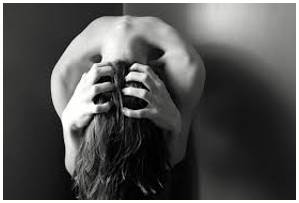 Anguished  - Experiencing or expressing severe mental or physical pain or suffering.