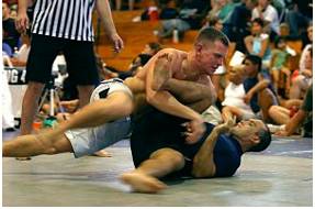 Grapple  - Struggle to deal with or overcome (a difficulty or challenge).