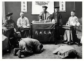 Kowtow  - To show somebody in authority too much respect and be too willing to obey them.