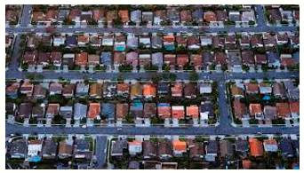 Sprawling  - Spreading in an untidy way.