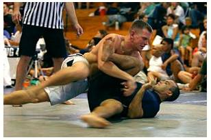Grapple  - Struggle to deal with or overcome (a difficulty or challenge).