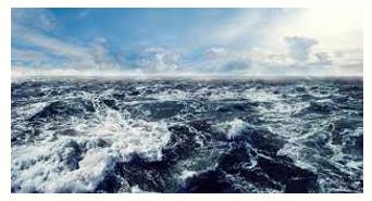 Choppy  - (of a sea, lake, or river) having many small waves.