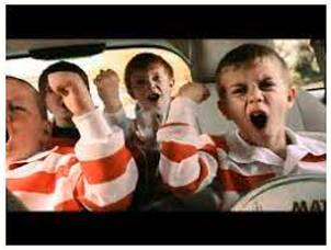Boisterously  - In a noisy way, full of life and energy.