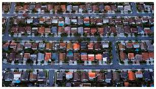 Sprawling  - Spreading in an untidy way.
