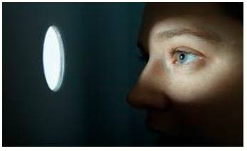 Lurk  - To wait somewhere secretly, especially because you are going to do something bad or illegal.