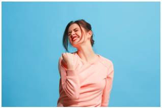 Gleefully  - In an exuberantly or triumphantly joyful manner.