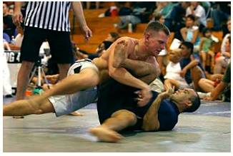 Grapple  - Struggle to deal with or overcome (a difficulty or challenge).