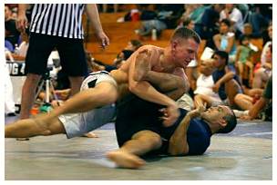 Grapple  - Struggle to deal with or overcome (a difficulty or challenge).