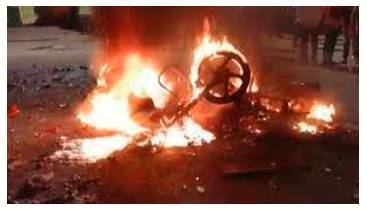 Flare  - Especially of anger and violence) to suddenly start or become much stronger.