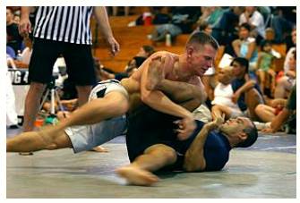 Grapple  - Struggle to deal with or overcome (a difficulty or challenge).
