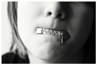 Reticence  - A dislike of telling people about things.