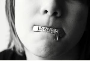 Reticence  - A dislike of telling people about things.