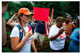 Supremacist  - A person who believes that their own race is better than others and should be in power.