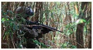 Ambush  - The act of hiding and waiting for somebody and then making a surprise attack on them.