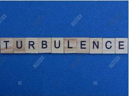 Turbulence  - a situation in which there is a lot of sudden change, trouble, argument and sometimes violence