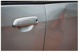 Dent  - To make a hollow place in a hard surface, usually by hitting it.