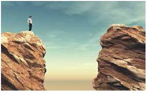 Chasm  - A deep opening or break in the ground.