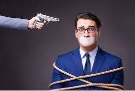 Hostage  - a person who is captured and held prisoner by a person or group, and who may be injured or killed if people do not do what the person or group is asking