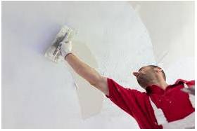 Plastered  - A substance made of lime, water and sand, that is put on walls and ceilings to give them a smooth hard surface.