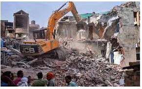 Razing  - To completely destroy a building, town, etc. so that nothing is left.