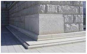 Cornerstone  - A stone at the corner of the base of a building, often laid in a special ceremony.