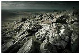 Rugged - Having a broken, rocky, and uneven surface.