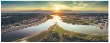 Confluence - The junction of two rivers, especially rivers of approximately equal width.