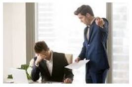 Criticized - Indicate the faults of (someone or something) in a disapproving way.