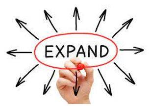 Expanded - To become or to make something bigger.