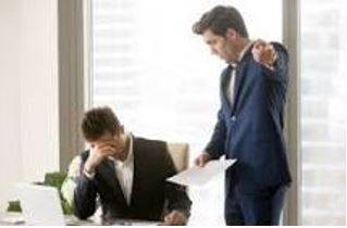 Criticized - Indicate the faults of (someone or something) in a disapproving way.