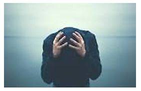 Desperately - Feeling or showing a hopeless sense that a situation is so bad as to be impossible to deal with.