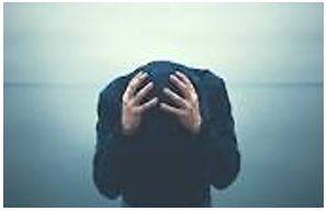 Desperately - Feeling or showing a hopeless sense that a situation is so bad as to be impossible to deal with.