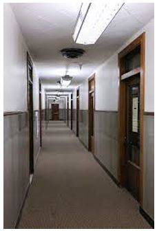 Corridor - A long passage in a building from which doors lead into rooms.