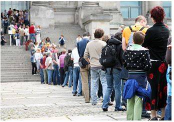 Patiently - A person's ability to wait something out or endure something tedious, without getting riled up.