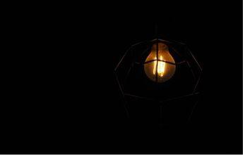 Dimmed - Make or become less bright or distinct.