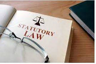 Statutorily - Required, permitted, or enacted by statute.