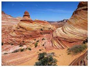 Erode - Gradually wear away (soil, rock, or land).