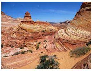 Eroded - Gradually wear away (soil, rock, or land).