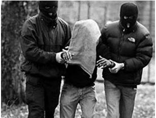 Abduction - The action of forcibly taking someone away against their will, typically to hold them captive.